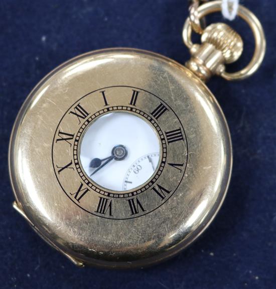 A gold plated pocket watch with 9ct gold albert hung with a 1900 half sovereign.